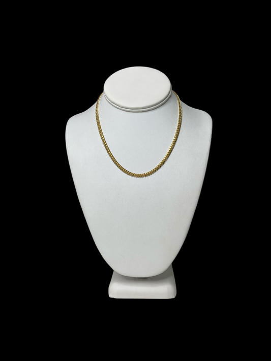 18KT Yellow Gold Cuban Link Chain necklace (16" 4mm) on a white mannequin bust against a black background