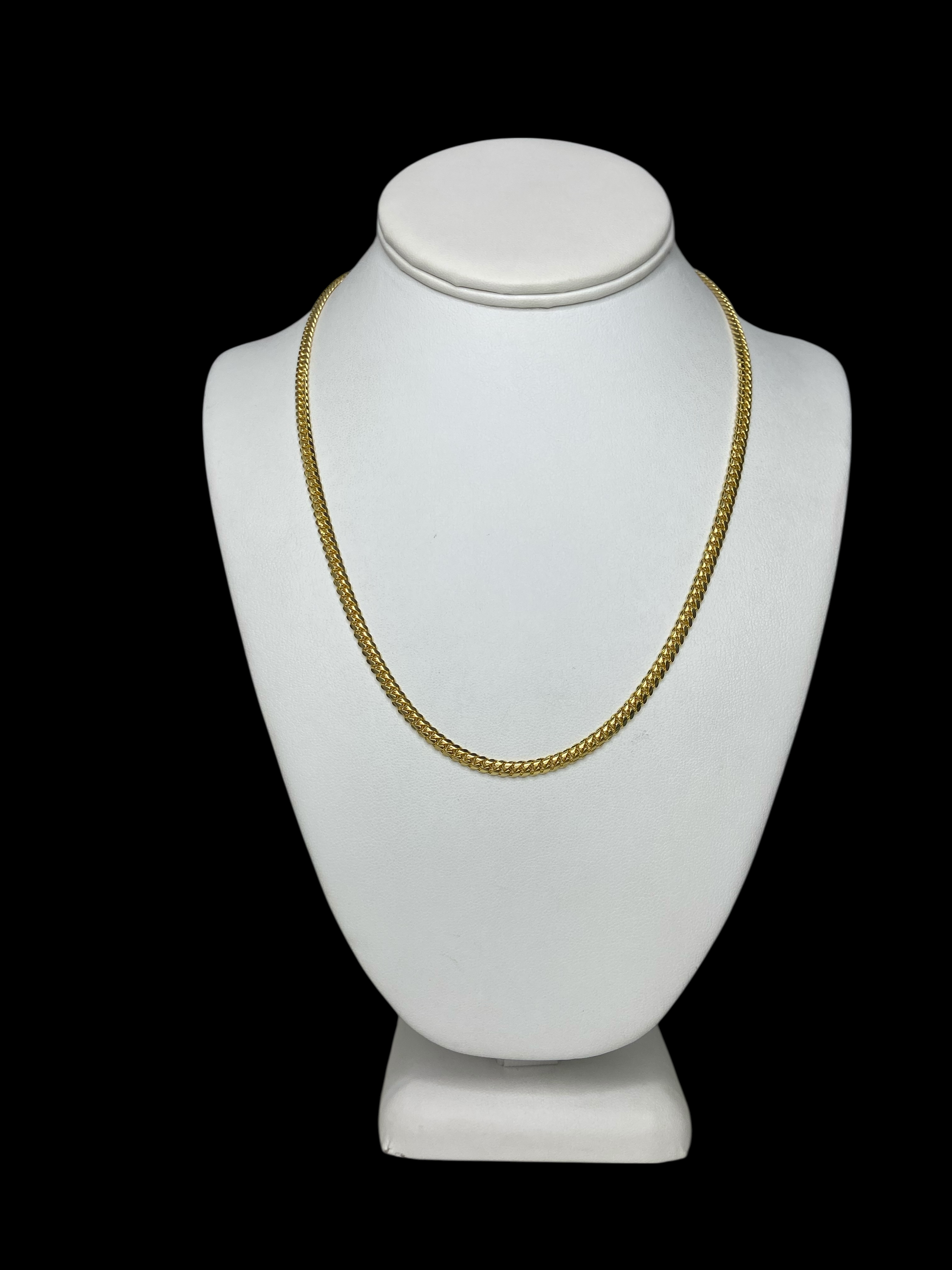18KT Yellow Gold Cuban Link Chain necklace (20" and 4 mm) on a white mannequin bust against a black background